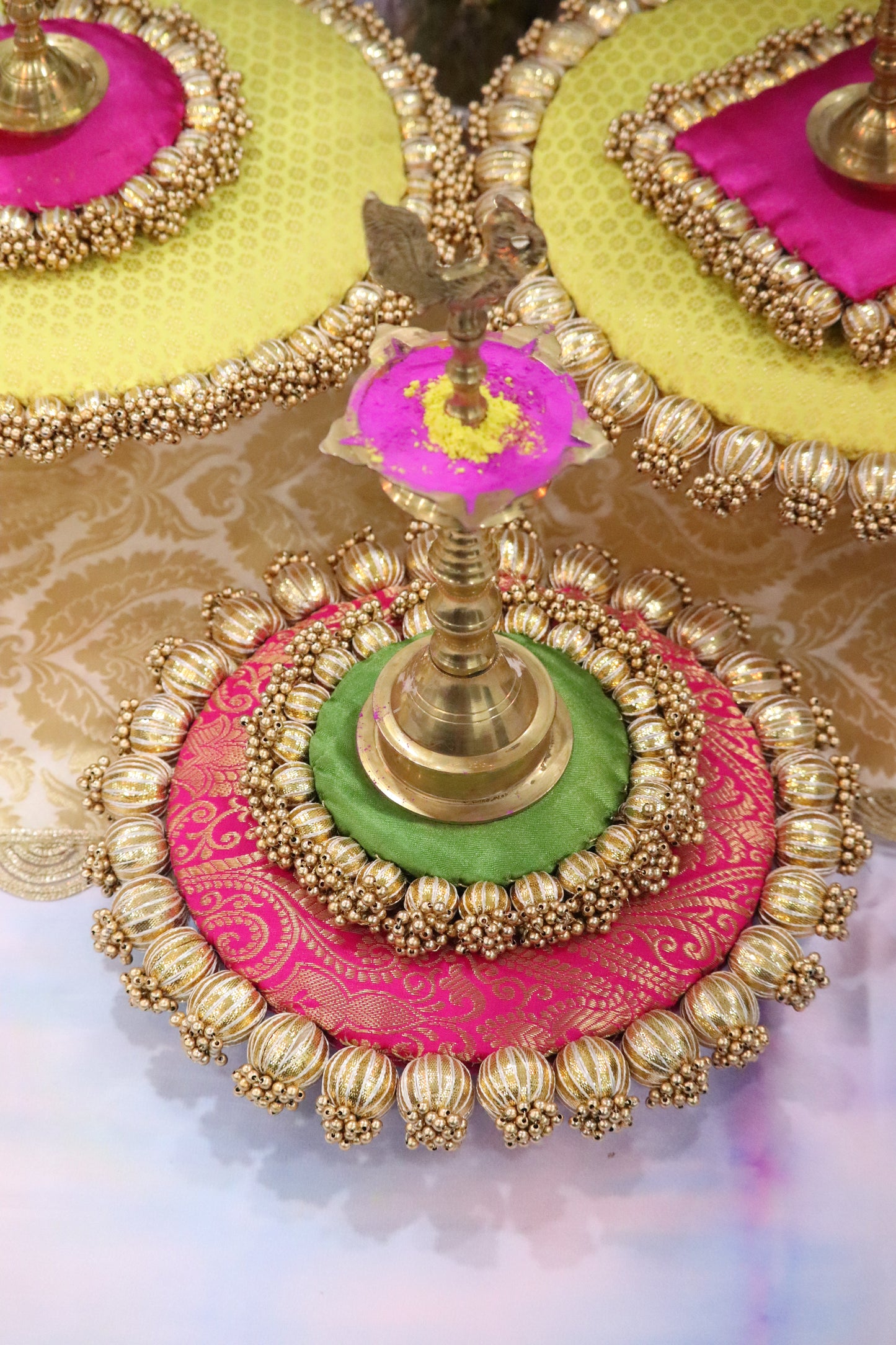 Sunny Blooms: Yellow and Pink Placemat Set with Brass Stands