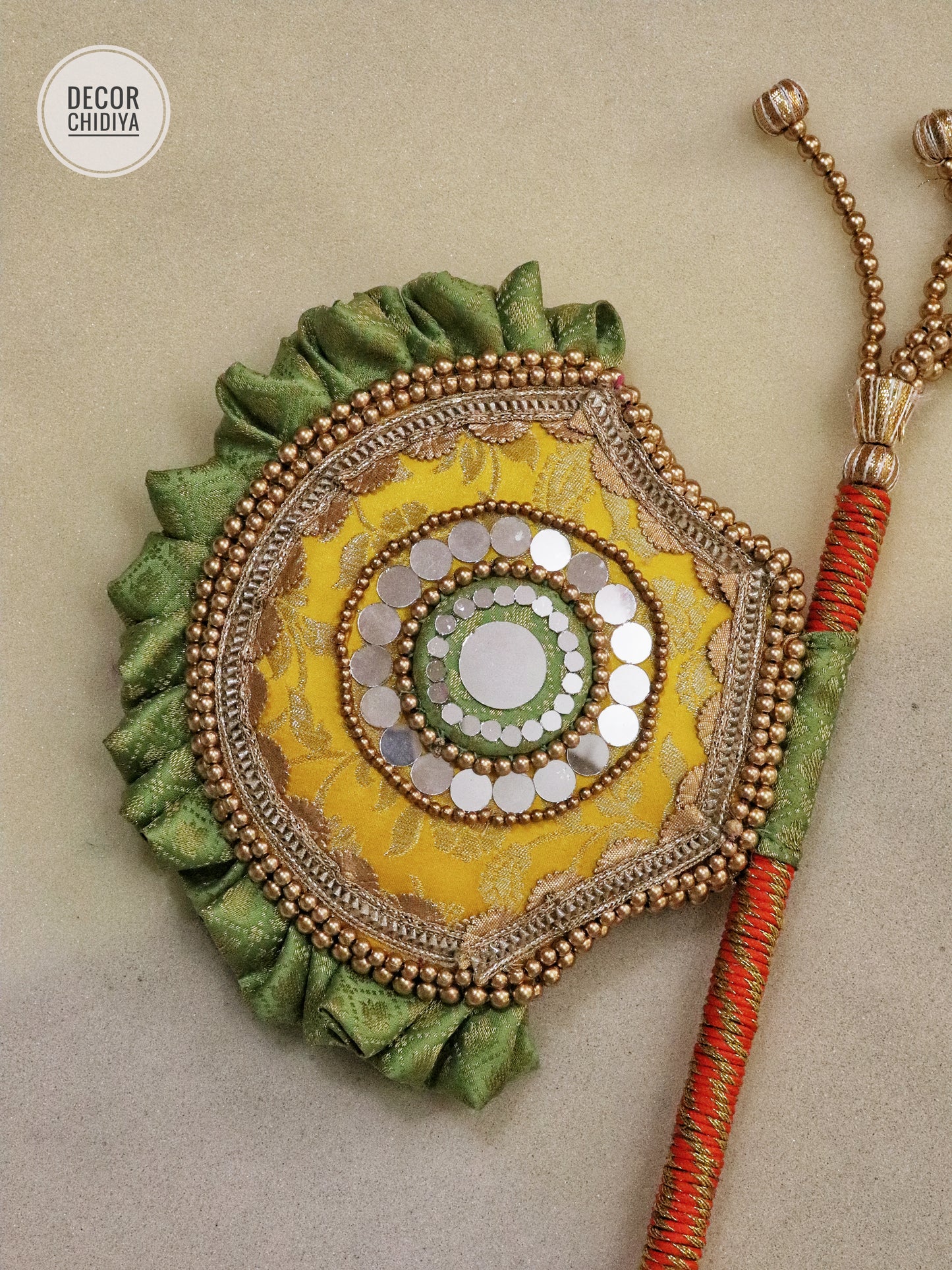 yellow and seagreen Beejana or handfan in Banarasi fabric and mirrorwork detail
