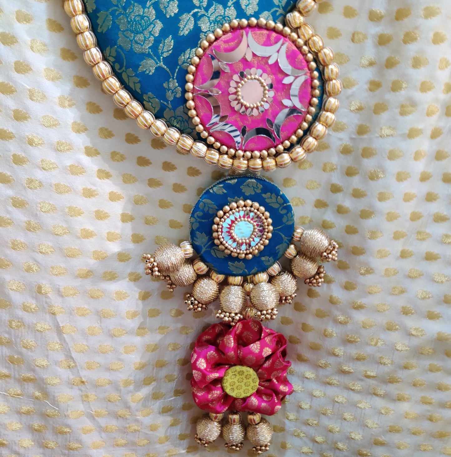 Raktund: Turquoise and Light Pink Wall Hanging