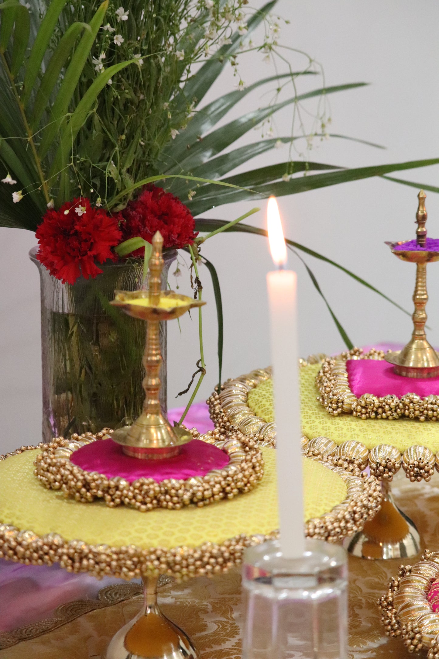 Sunny Blooms: Yellow and Pink Placemat Set with Brass Stands