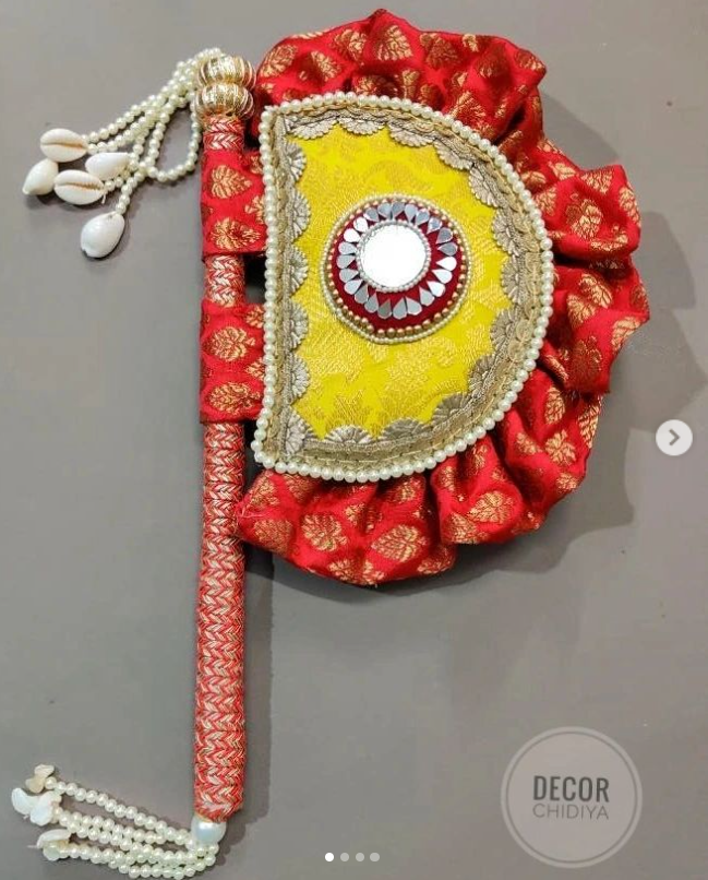 Yellow and Red Beejana or handfan in Banarasi fabric and mirrorwork detail