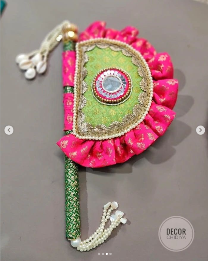 Pistachio and pink Beejana or handfan in Banarasi fabric and mirrorwork detail