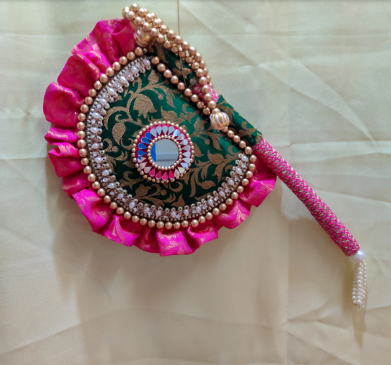 Emerald green and magenta Beejana or handfan in Banarasi fabric and mirrorwork detail