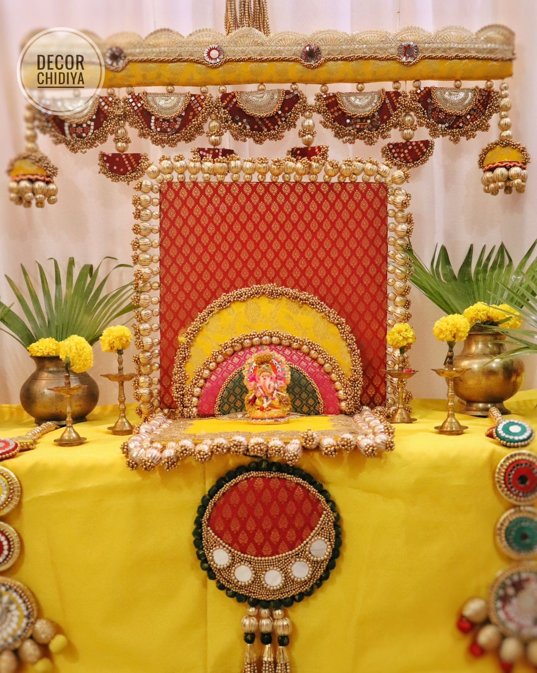 Tilak - Beautiful temple decor setup -Red and yellow temple decor