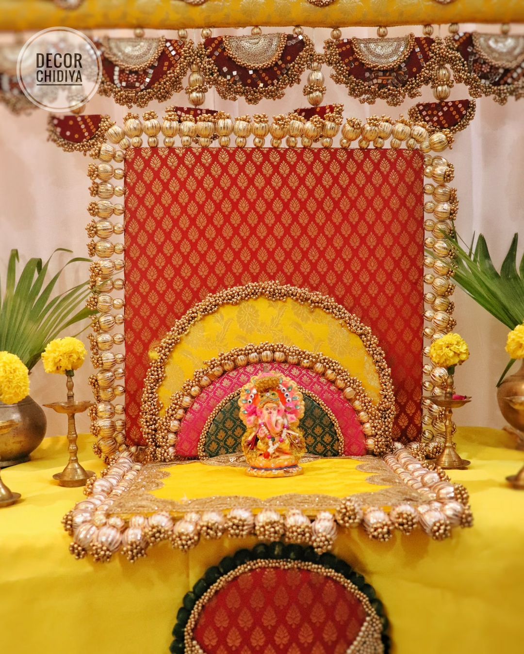 Tilak - Beautiful temple decor setup -Red and yellow temple decor