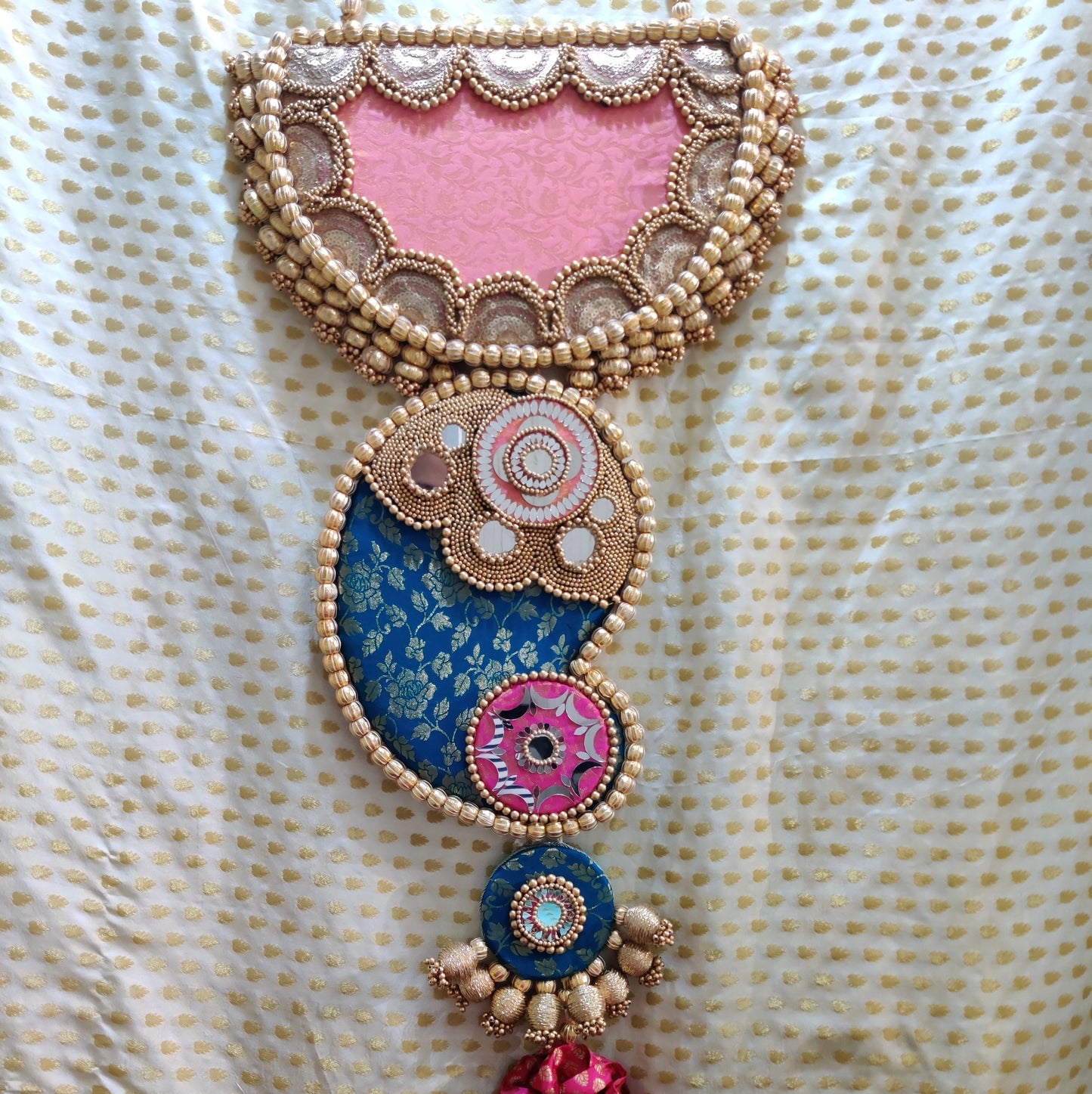 Raktund: Turquoise and Light Pink Wall Hanging