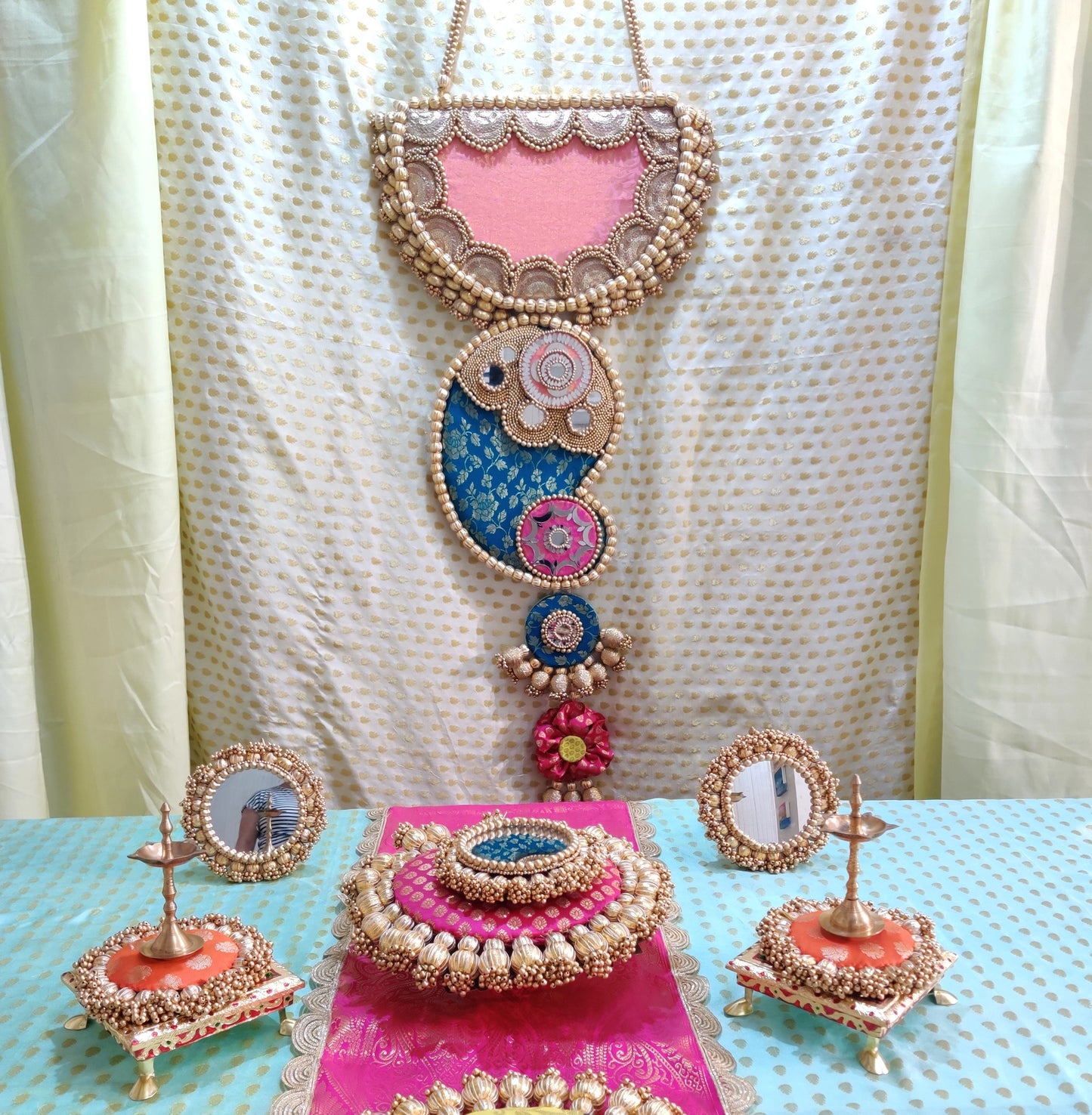 Raktund: Turquoise and Light Pink Wall Hanging