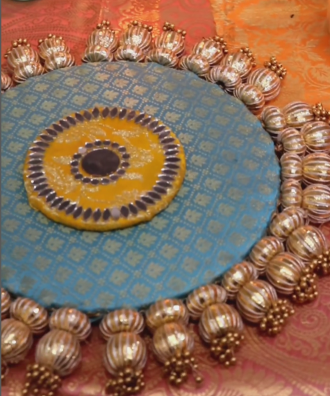 n  -Embellished  placemat - golden beads